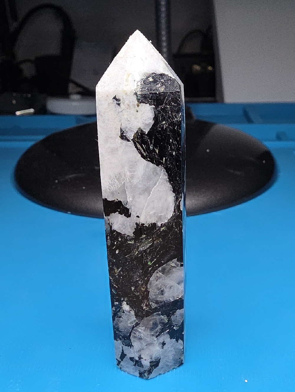 This is a polished Rainbow Moonstone obelisk point.